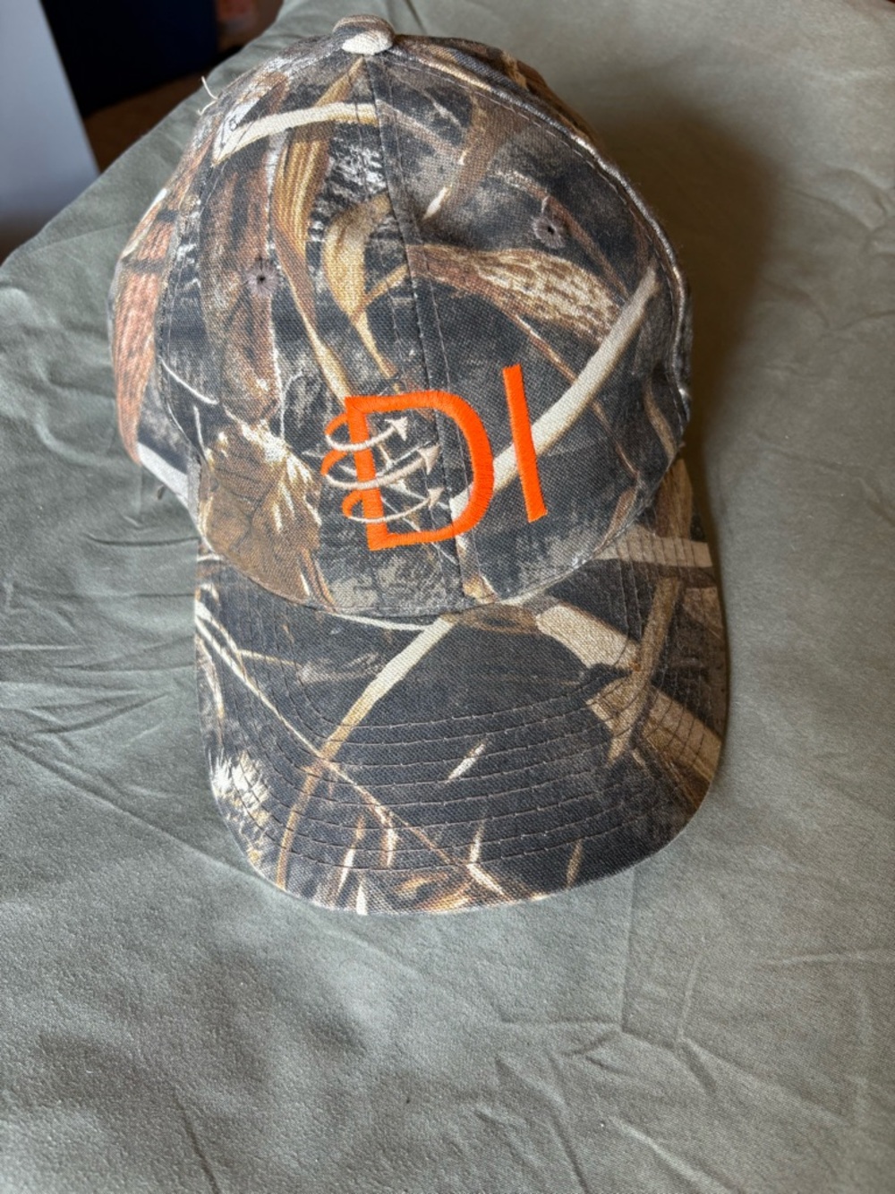 Realtree Camouflage Baseball Cap with Orange Logo